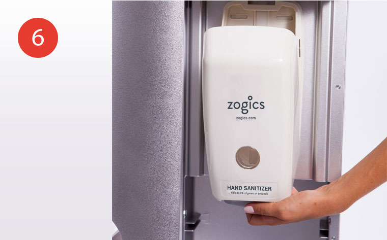 Open front of hand sanitizer dispenser